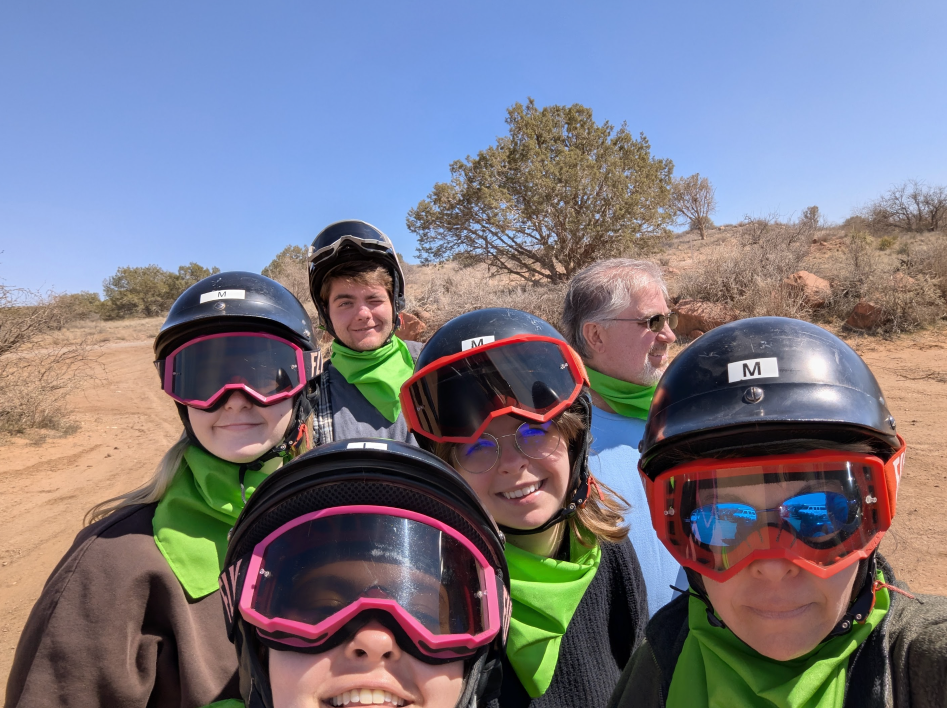 A group posting for photo during ATV tour