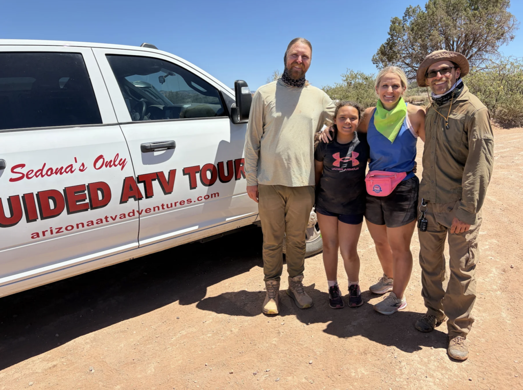 Guests posing with ATV tour guides