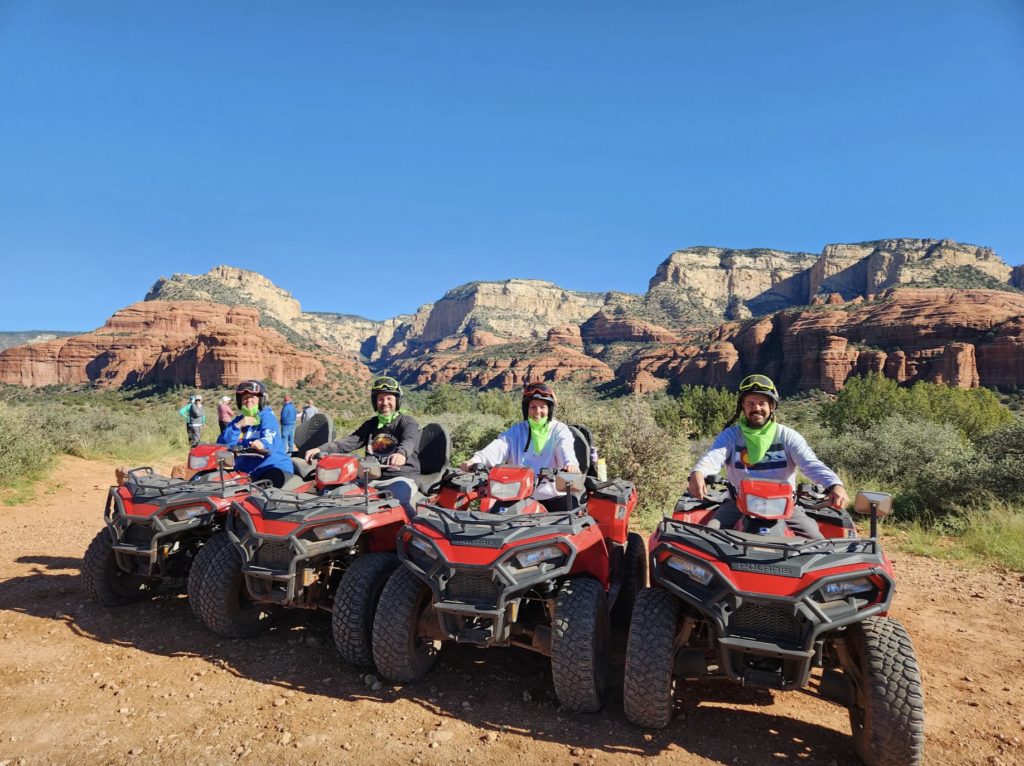 A group of people riding ATVs on an off-road tour in Sedona, Arizona