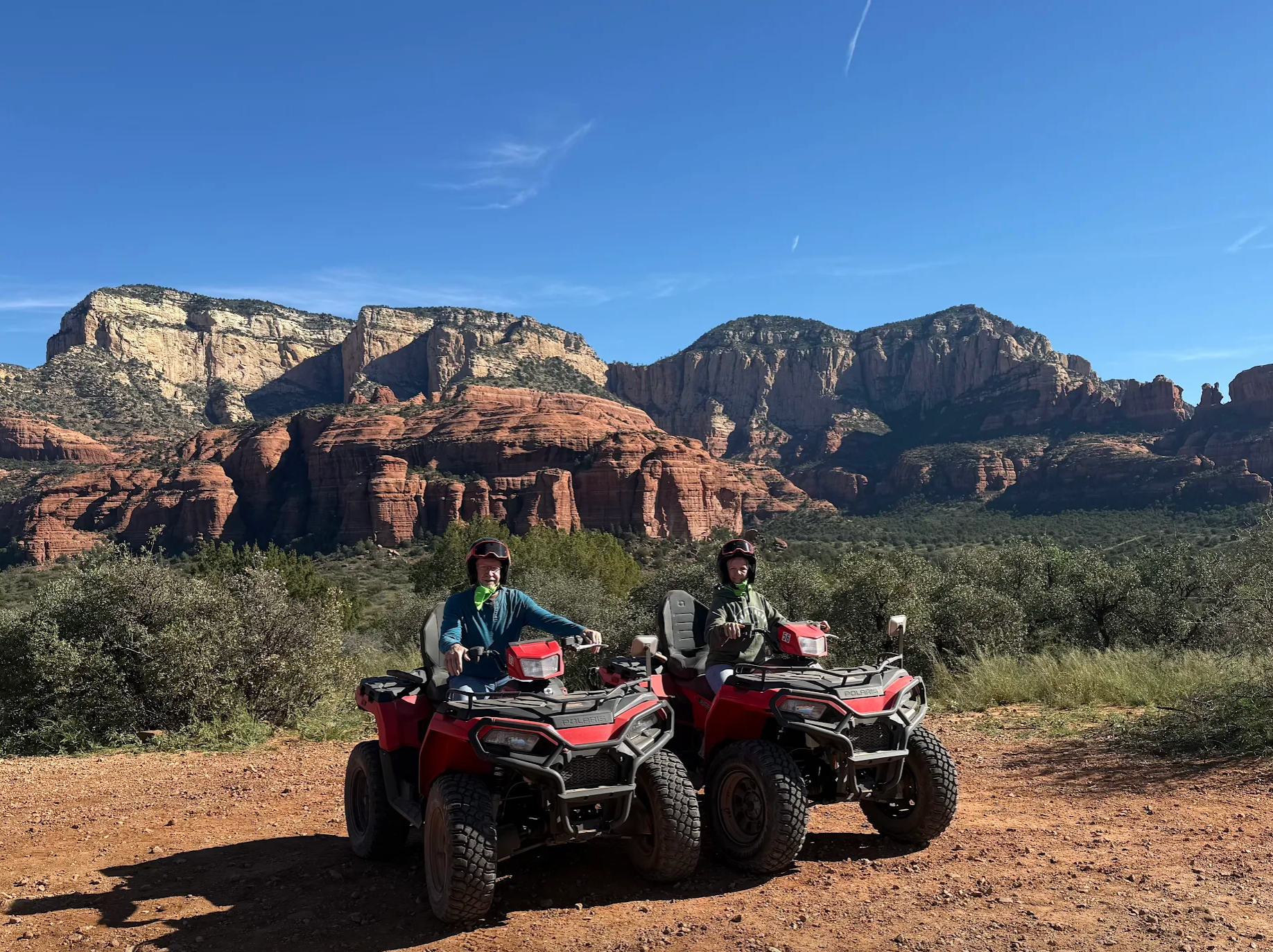 Two people riding ATVs while exploring Sedona’s scenic red rock landscape