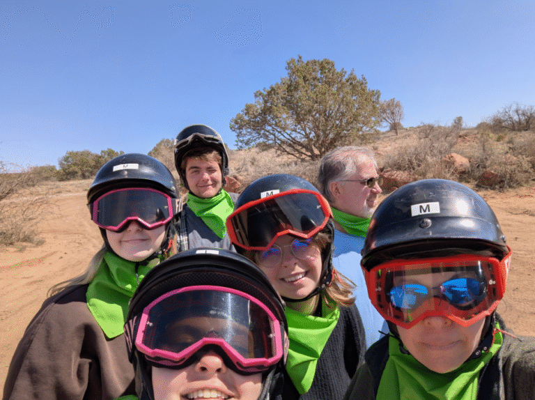 Family enjoying an ATV adventure through Sedona red rocks at Thanksgiving