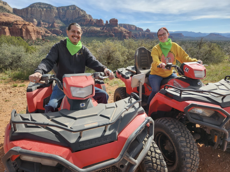 Couple enjoying ATV Tours in Arizona desert at sunset for Valentine's Day