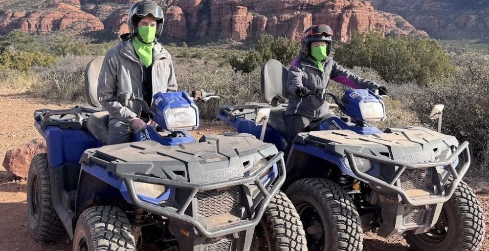 Vibrant red rock formations at sunset, rugged trails winding through desert landscapes, an ATV navigating through scenic vistas, blooming cacti and wildflowers, expansive sky filled with dramatic clouds, capturing the adventurous spirit of exploring Sedona’s hidden gems.