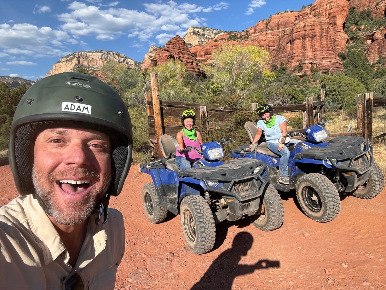 Vibrant red rock formations under a bright blue sky, rugged ATV trails winding through desert landscapes, cacti and juniper trees dotting the terrain, panoramic views of Sedona's stunning scenery, vivid colors capturing the essence of Arizona's wilderness.